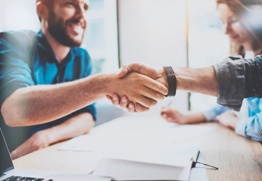 handshake at meeting for selling a business